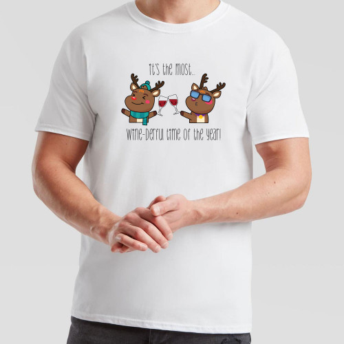 White T-Shirt printed with cheerful design of reindeer enjoying a tipple and the text It’s The Most Wine-derful Time of The Year across the chest.