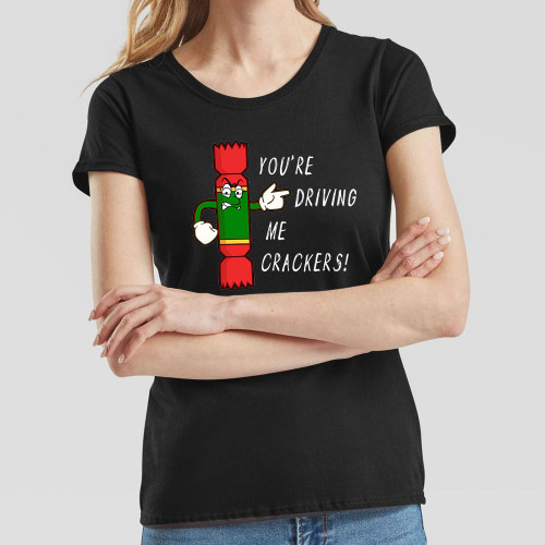 Black Ladies T-Shirt printed with text You’re Driving Me Crackers and a cartoon anthropomorphised Christmas cracker pointing to the wearer’s left.