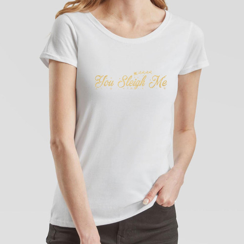 White Ladies T-Shirt with slogan You Sleigh Me in gold effect print across the chest surrounded by tiny snowflakes and the silhouette of Santa’s sleigh pulled by a team of reindeer.